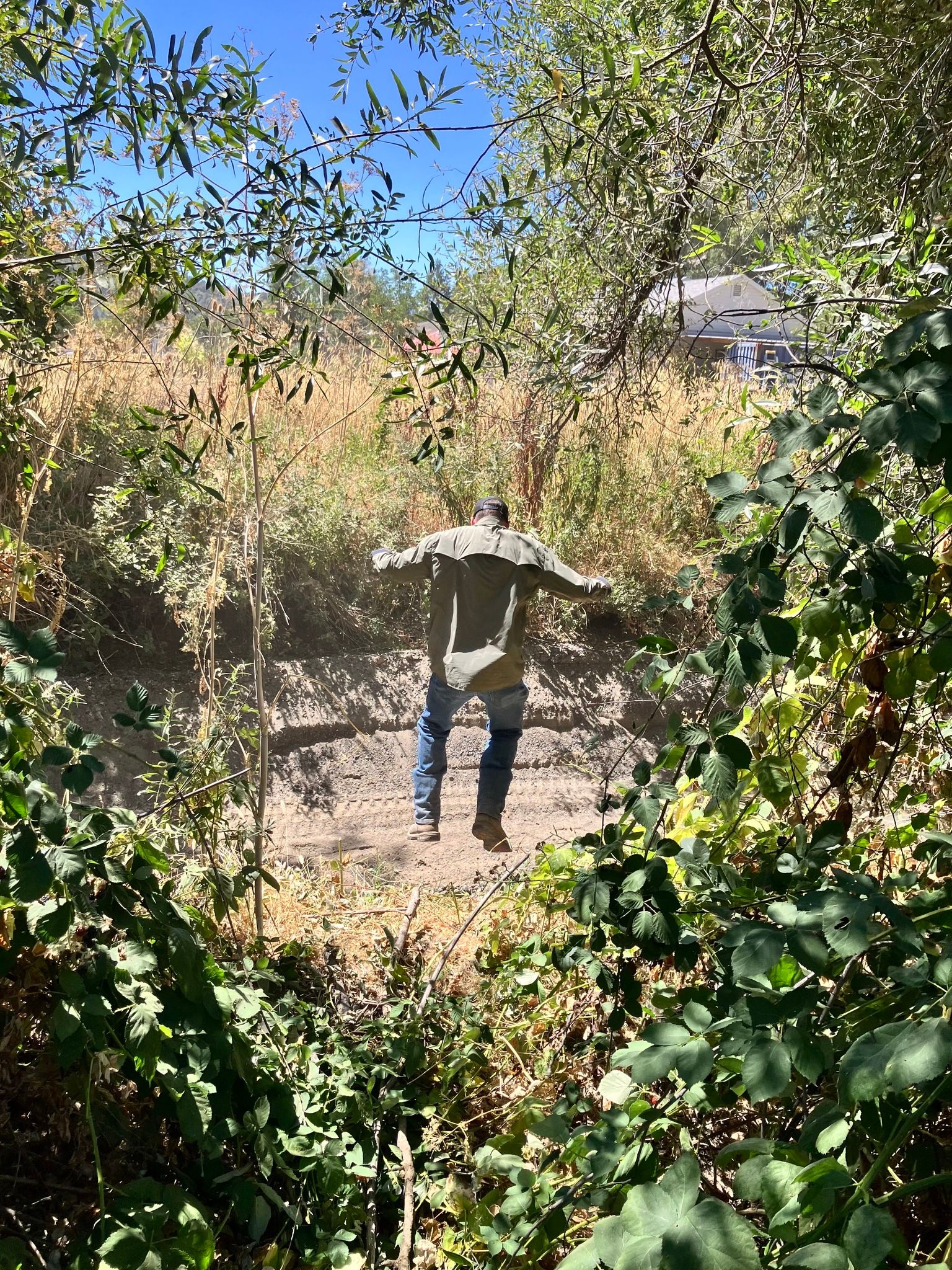 Chris from Lake County Water Resources jumping for joy! “The creek sediment was this high!” (August 2025)