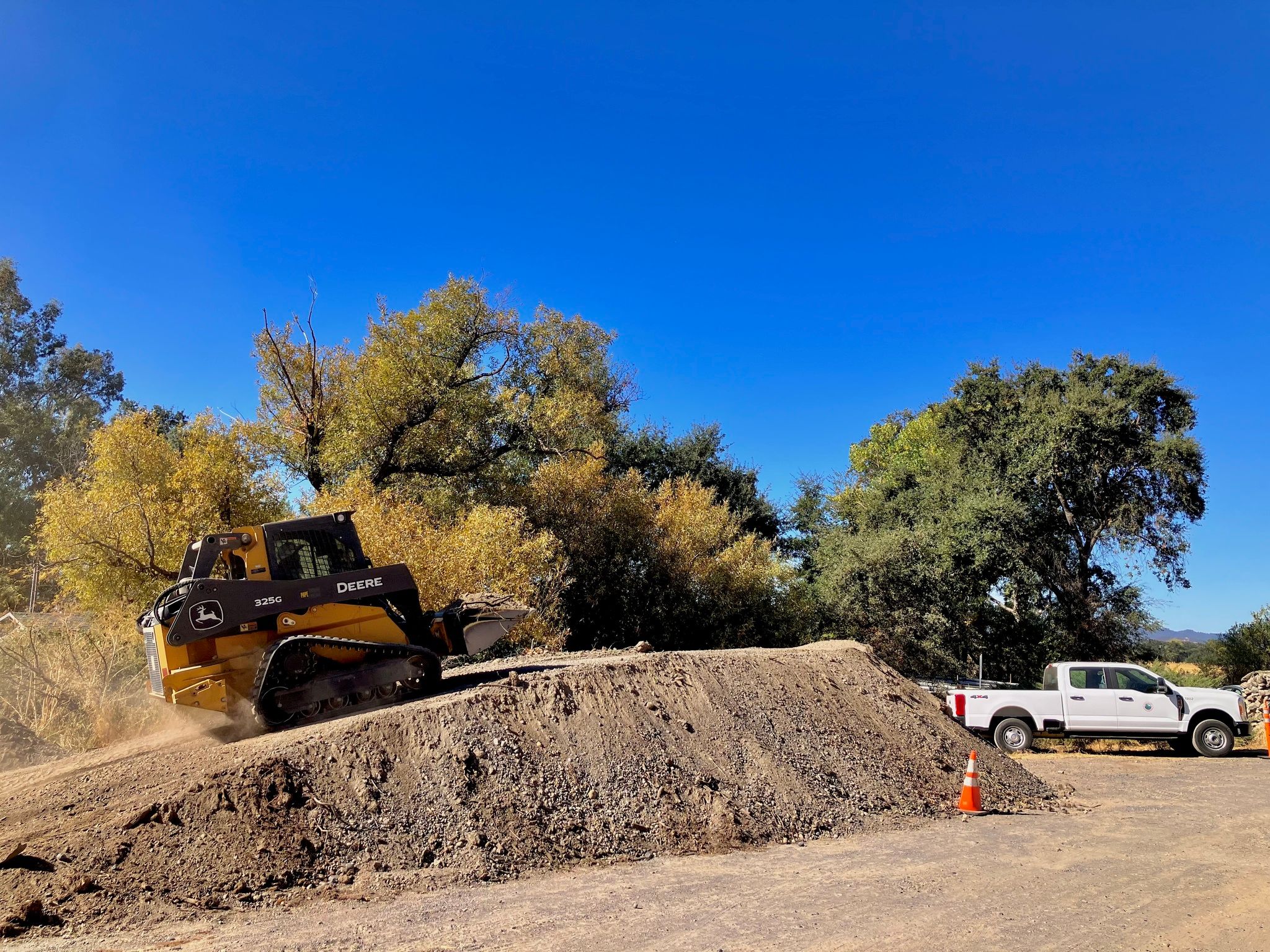 Sediment that was removed from the creek upstream from the drainage pipe