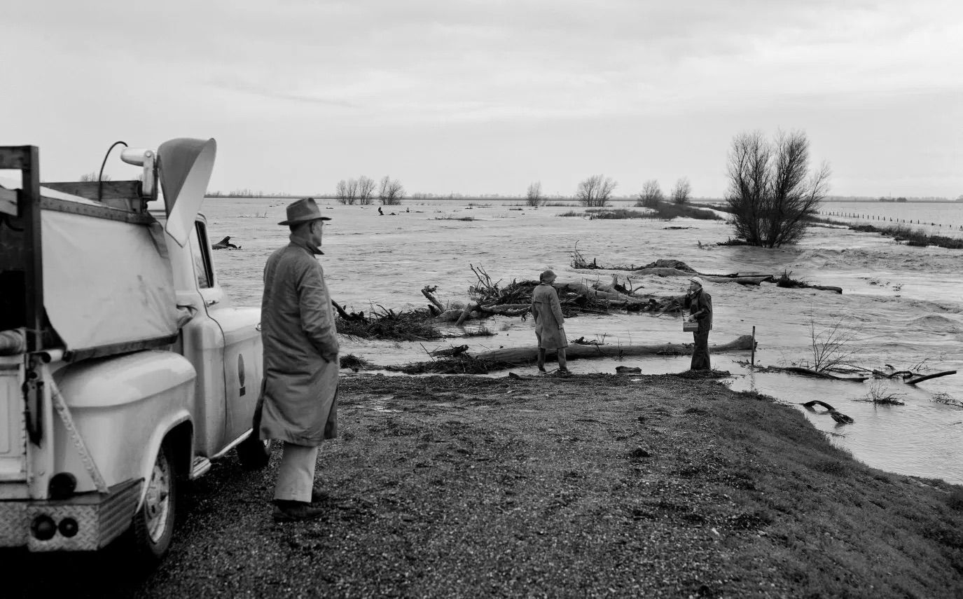 Checking floodwater conditions along the Cache Creek training levee, Yolo County, 1958. Source: California Department of Water Resources